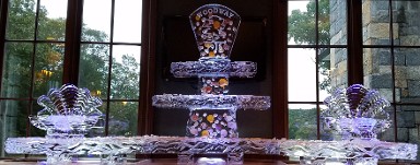Ice Matters - 120 inch base tray with Shells frozen into support legs and topper of two tier tray in center - small open shells on each end