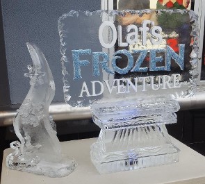 Logo with Snowfill and Blue Glitter next to Abstract Snowflake Tower