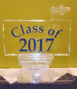 Class of logo with colored sand and graduation cap topper