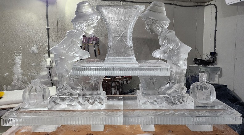 13.)  ice matters 80 inch base tray with shrimp tower on raised center tray and carved pilgrim boy and pumpkin lemon holder on each side