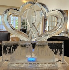 ice matters linking hearts ironed smooth with large snowfilled plaque in front with names and toasting glasses
