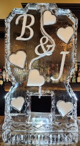 ice matters single pour drink luge with snowfilled initials and hearts