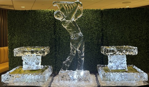 ice matters - golfer swinging club with small rocky 2-tier tray on each side