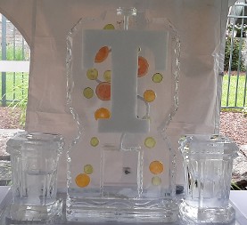 ice matters - single pour drink luge with fruit frozen into block and snowfilled letter - individual bottle holder on each side