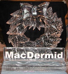 Snowfilled Logo in front of Wreath with Bow 